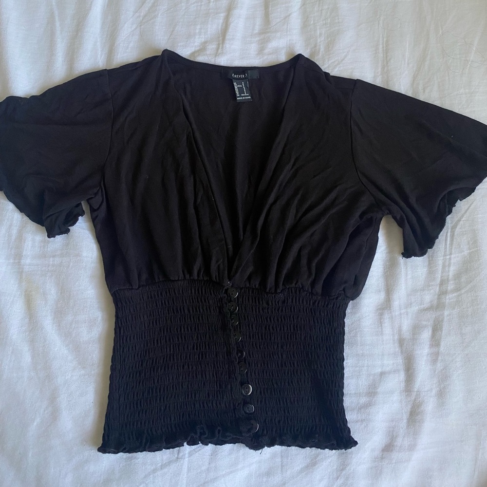 Small black dress shirt with buttons